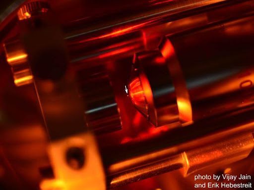 Nanoparticle levitation experiment using Koheras BOOSTIK low noise fiber laser in vacuum chamber