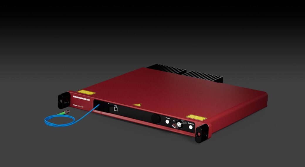 Koheras Adjustik single frequency fiber laser system on dark background