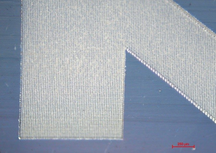 PTFE transparent tube with high‑contrast permanent marking created by ORIGAMI XPS femtosecond laser in non‑thermal polymer processing workflows.