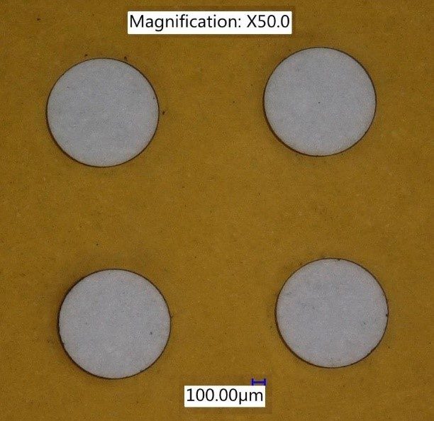 polyimide sheet micromachined with ORIGAMI XPS femtosecond laser for high‑precision, non‑thermal material processing in medical and electronics applications.